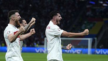 Turkey's Samet Akaydin, right, with teammates celebrates after scoring his side's opening goal during a quarterfinal match between the Netherlands and Turkey at Euro 2024