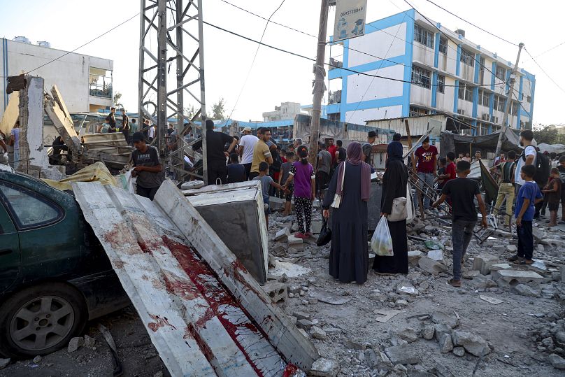 Blood can be seen in the aftermath of an Israeli airstrike on a UN-run school that killed dozens of Palestinians in Gaza, July 6, 2024