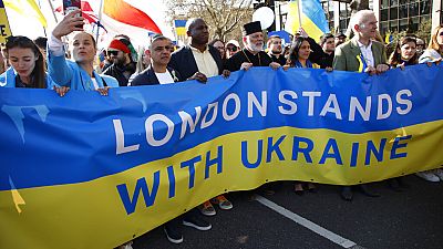 Mayor of London Sadiq Khan, third left, and Labour Party MP David Lammy, fourth left, join demonstrators taking part in the 'London stands with Ukraine' solidarity march.