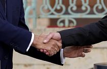 German Chancellor Olaf Scholz and French President Emmanuel Macron shake hands during a press conference in Meseberg, 28 May 2024, File, Closeup