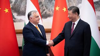 Hungarian Prime Minister Viktor Orbán and Chinese President Xi Jinping shake hands before a meeting at the Great Hall of the People in Beijing.