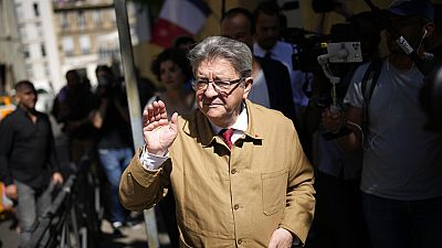 Hard-left figure Jean-Luc Melenchon leaves after voting in the first round of the parliamentary election, Sunday, June 12, 2022 in Marseille, France.