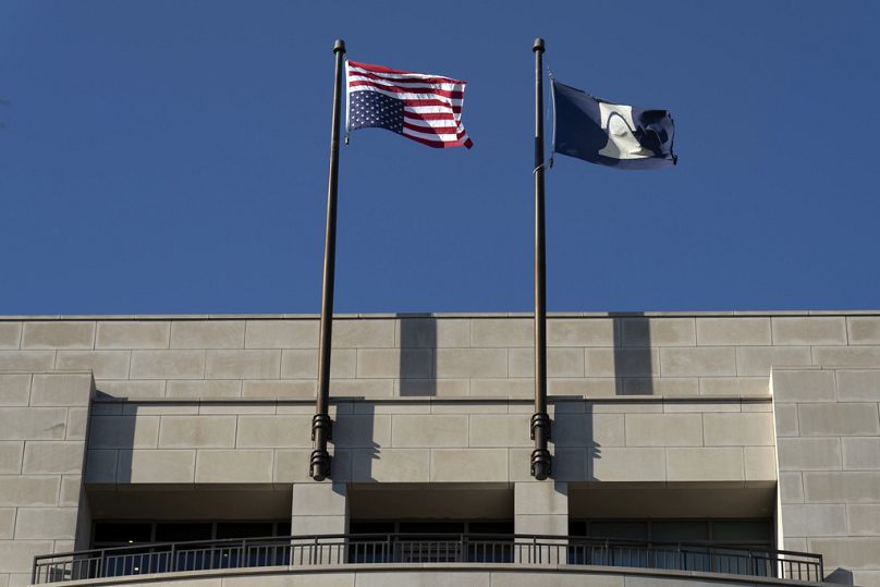 An upside-down US flag flies above the offices of the Heritage Foundation.