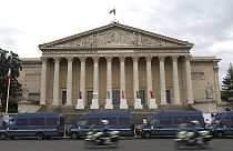 Police vans park outside the National Assembly during the second round of the legislative elections, Sunday, July 7, 2024 in Paris. 