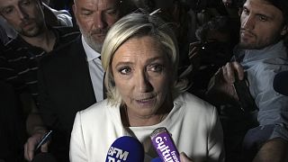Far-right National Rally party leader Marine Le Pen answers reporters after the second round of the legislative election at the party election night HQ in Paris, 7 July 2024