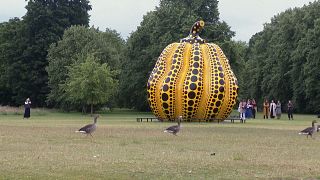 Large pumpkin sculpture by Japanese artist Yayoi Kusama in London’s Kensington Gardens.