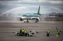 An air cannon salute greets an Aer Lingus flight arriving at Bradley International Airport in Windsor Locks, Conn., Wednesday, Sept. 28, 2016.
