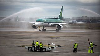 An air cannon salute greets an Aer Lingus flight arriving at Bradley International Airport in Windsor Locks, Conn., Wednesday, Sept. 28, 2016.