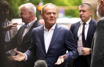 FILE - Poland's Prime Minister Donald Tusk speaks with the media as he arrives for a meeting of the EPP party ahead of an EU summit in Brussels, Monday, June 17, 2024.