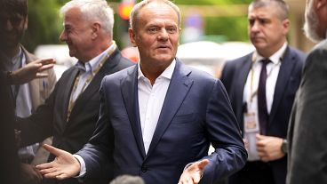 FILE - Poland's Prime Minister Donald Tusk speaks with the media as he arrives for a meeting of the EPP party ahead of an EU summit in Brussels, Monday, June 17, 2024.