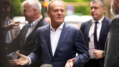 FILE - Poland's Prime Minister Donald Tusk speaks with the media as he arrives for a meeting of the EPP party ahead of an EU summit in Brussels, Monday, June 17, 2024.