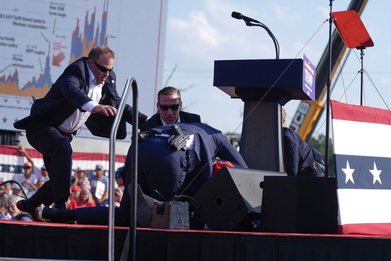 U.S. Secret Service agents converge to cover Republican presidential candidate former President Donald Trump at a campaign rally,