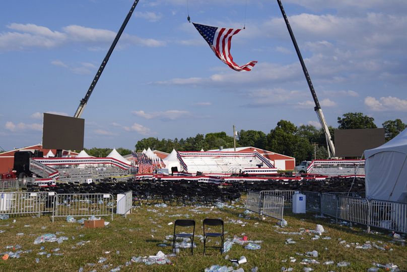 A campaign rally site for Republican presidential candidate former President Donald Trump is empty and littered with debris Saturday