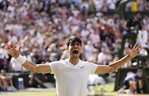 Carlos Alcaraz of Spain celebrates after defeating Novak Djokovic of Serbia during the men's singles final at the Wimbledon tennis championships in London, Sunday, July 14.