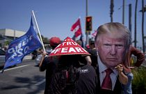 People rally in support of Republican presidential candidate former President Donald Trump in Huntington Beach, Calif., Sunday, July 14, 2024. (AP Photo/Eric Thayer)