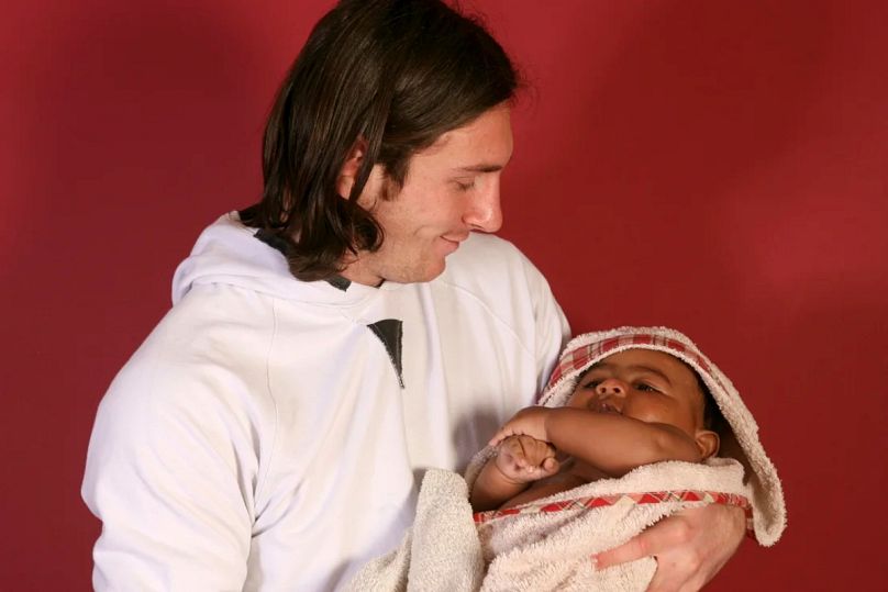 Lionel Messi holds a baby Lamine Yamal for the photoshoot in 2007