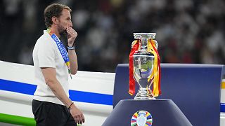 England's manager Gareth Southgate walks past the trophy at the end of the final match between Spain and England at the Euro 2024 tournament in Berlin, 14/07/2024