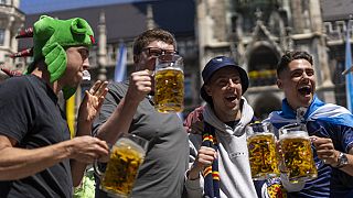 Scotland's football team fans drink beer in 'Marienplatz' square next to the town hall in downtown, Munich , Germany, Thursday, June 13, 2024. 