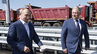 Putin drives a new Russian Lada sedan on just opened final segment of Moscow-St Petersburg highway