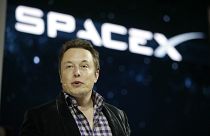 File - In this May 29, 2014 file photo, Elon Musk, CEO and CTO of SpaceX, introduces the SpaceX Dragon V2 spaceship at the SpaceX headquarters in Hawthorne, Calif. 