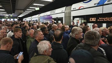 Football fans gather on train station ahead the Group C match between Serbia and England at the Euro 2024 soccer tournament in Gelsenkirchen, Germany