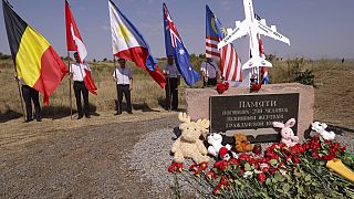 Flowers and toys put at a symbolic place in memory of killed passengers at the crash site of Malaysia Airlines Flight 17 near the village of Hrabove
