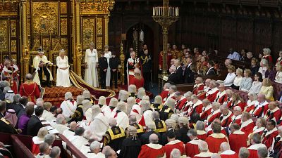 King Charles III reads the King's Speech, with Queen Camilla sitting beside him during the State Opening of Parliament in the House of Lords, London,.