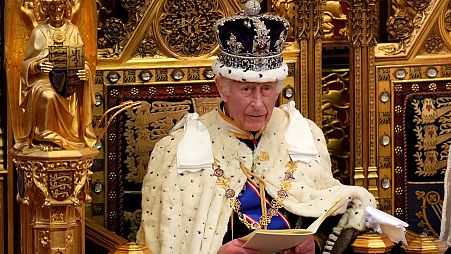 King Charles III looks up as he reads the King's Speech, during the State Opening of Parliament in the House of Lords, London, Wednesday, July 17, 2024. 