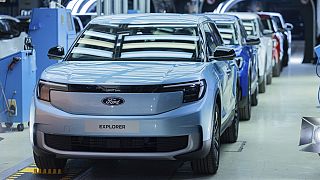 Ford Explorer electric cars stand in the hall at the start of production, in Cologne, Germany, Tuesday June 4, 2024. 