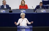 EU Commission President Ursula von der Leyen addresses the European Parliament as its president Roberta Metsola looks on, July 18, 2024