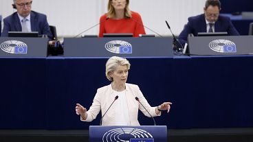 EU Commission President Ursula von der Leyen addresses the European Parliament as its president Roberta Metsola looks on, July 18, 2024