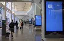 Screens show a blue error message at a departure floor of LaGuardia Airport in New York on Friday, July 19, 2024, after the Crowdstrike outage.