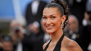 Bella Hadid poses for photographers at the premiere of the film 'Beating Hearts' at the 77th Cannes international film festival. 