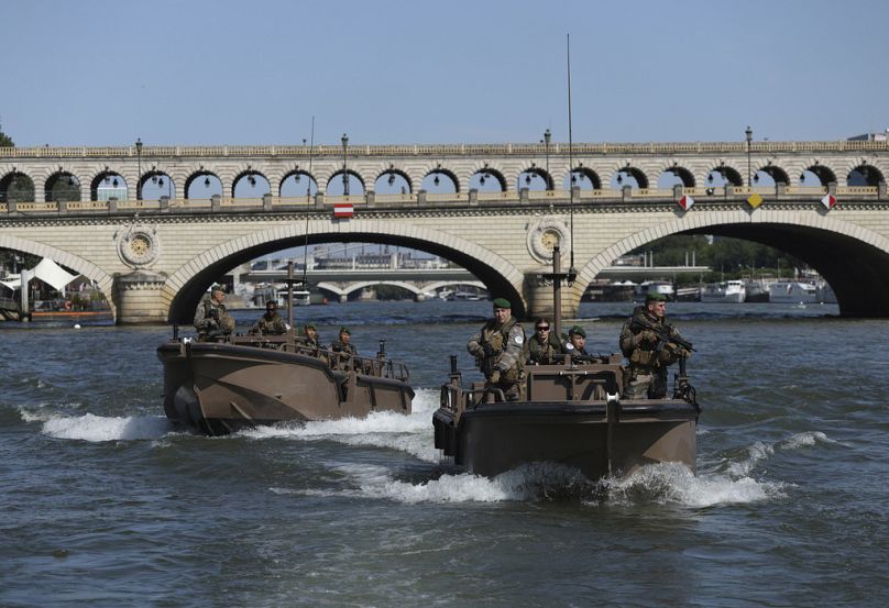 Soldiers patrol on the Seine river, Wednesday, July 17, 2024 in Paris. France's armed forces held a demonstration of the security measures planned on the River Seine, both in 