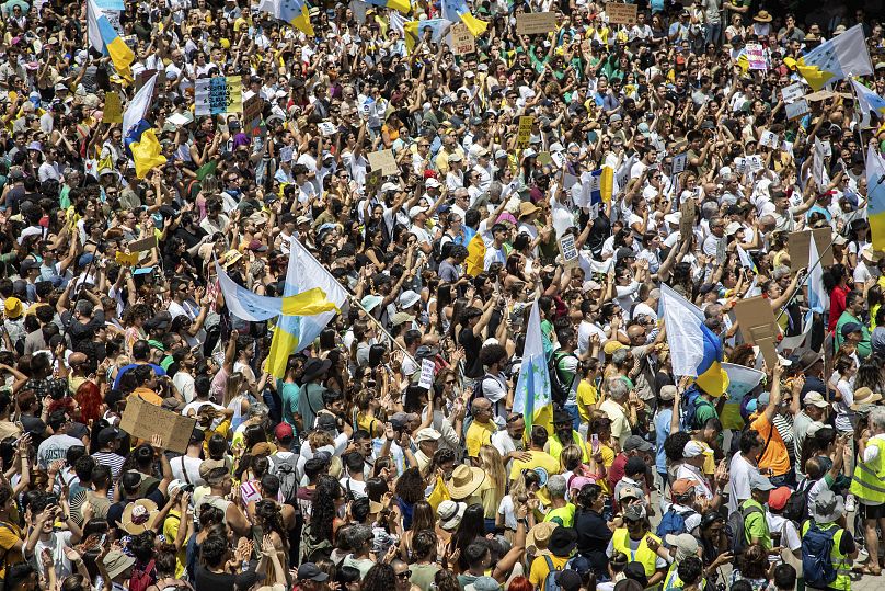 People at a mass demonstration against overtourism in Las Palmas de Gran Canaria, April 20, 2024