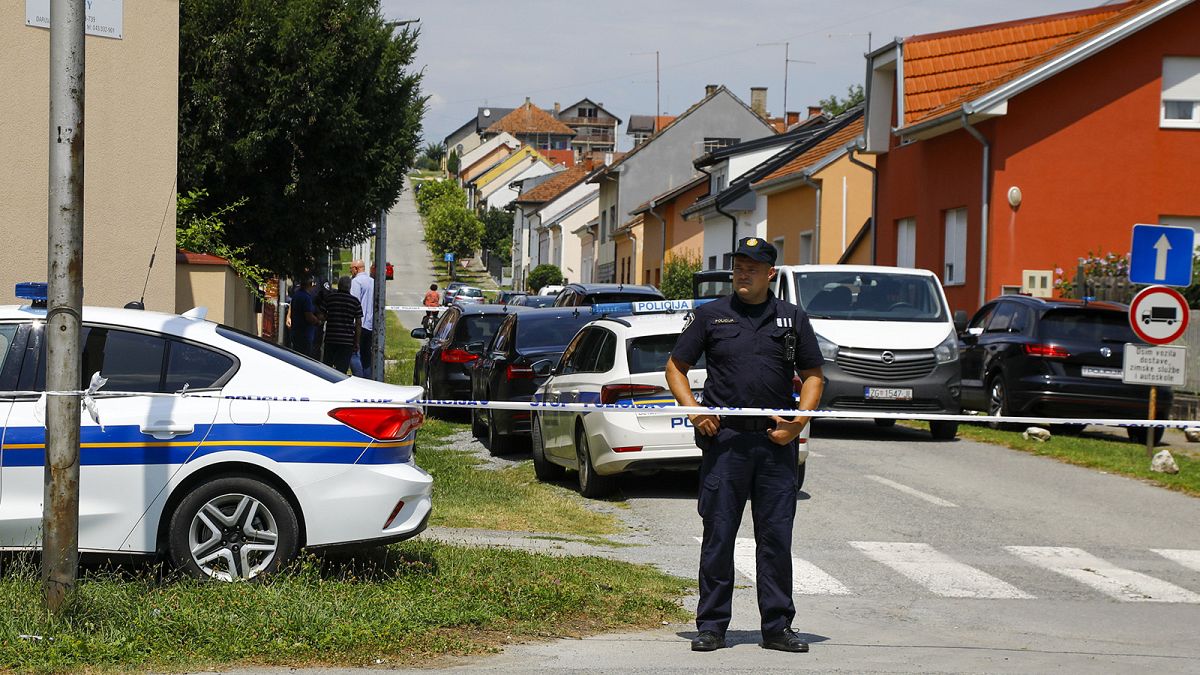 A police officer stands near the crime scene in Daruvar, 22 July 2024