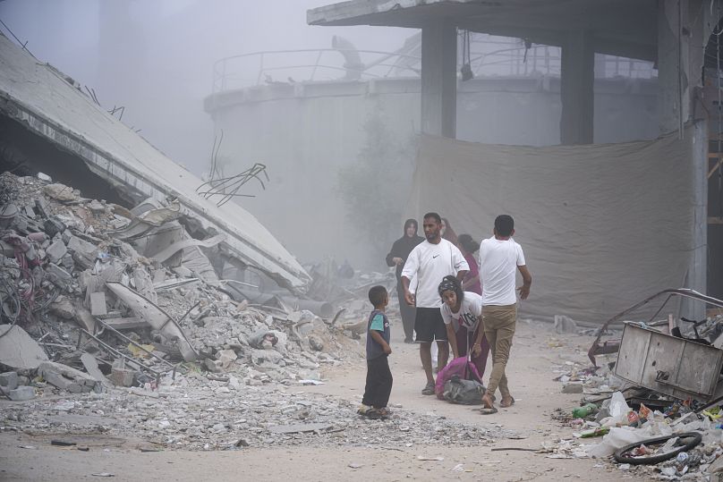 Palestinians displaced by the Israeli air and ground offensive on the Gaza Strip flee from parts of Khan Younis following an evacuation order.