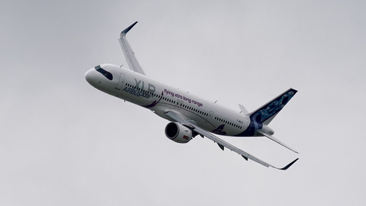 Airbus' A321 XLR in flight above the 2024 Farnborough Air Show fair .