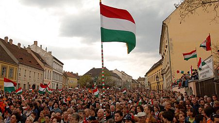 Supporters of the senior opposition party, the Fidesz - Hungarian Civic Alliance wave flags during a campaign rally in the Castle of Buda in Budapest, Monday, 10 April 2006. 