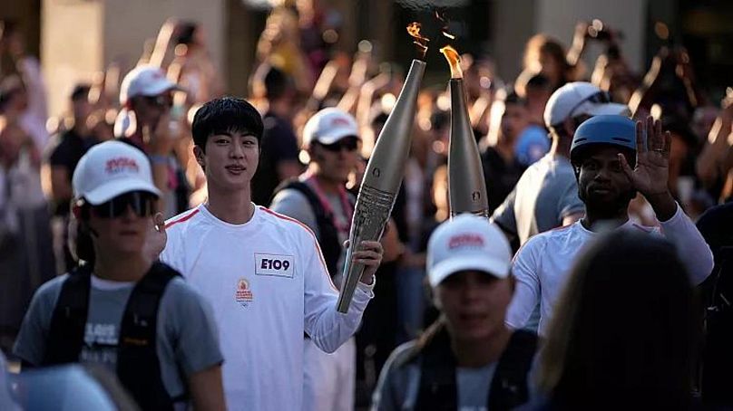 Jin, member of K-pop supergroup BTS, takes the Olympic torch - 14 July 2024