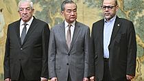China's Foreign Minister Wang Yi, Mahmoud al-Aloul, vice chairman of Fatah, and Mussa Abu Marzuk, a senior member of Hamas