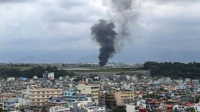 Smoke rises from the Tribhuvan International Airport in Kathmandu, Nepal, Wednesday, July 24, 2024.