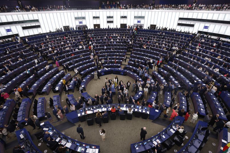 Members of European Parliament enter the plenary chamber as they prepare to vote at the European Parliament in Strasbourg, eastern France, Thursday, July 18, 2024.