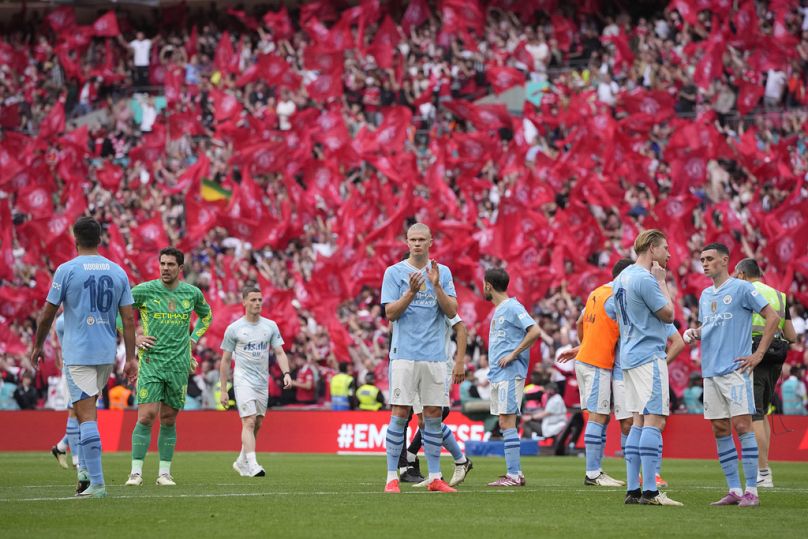 Manchester City's Erling Haaland, centre, applauds fans at the end of the English FA Cup final between Manchester City and West Ham United, 19 May 2024. 