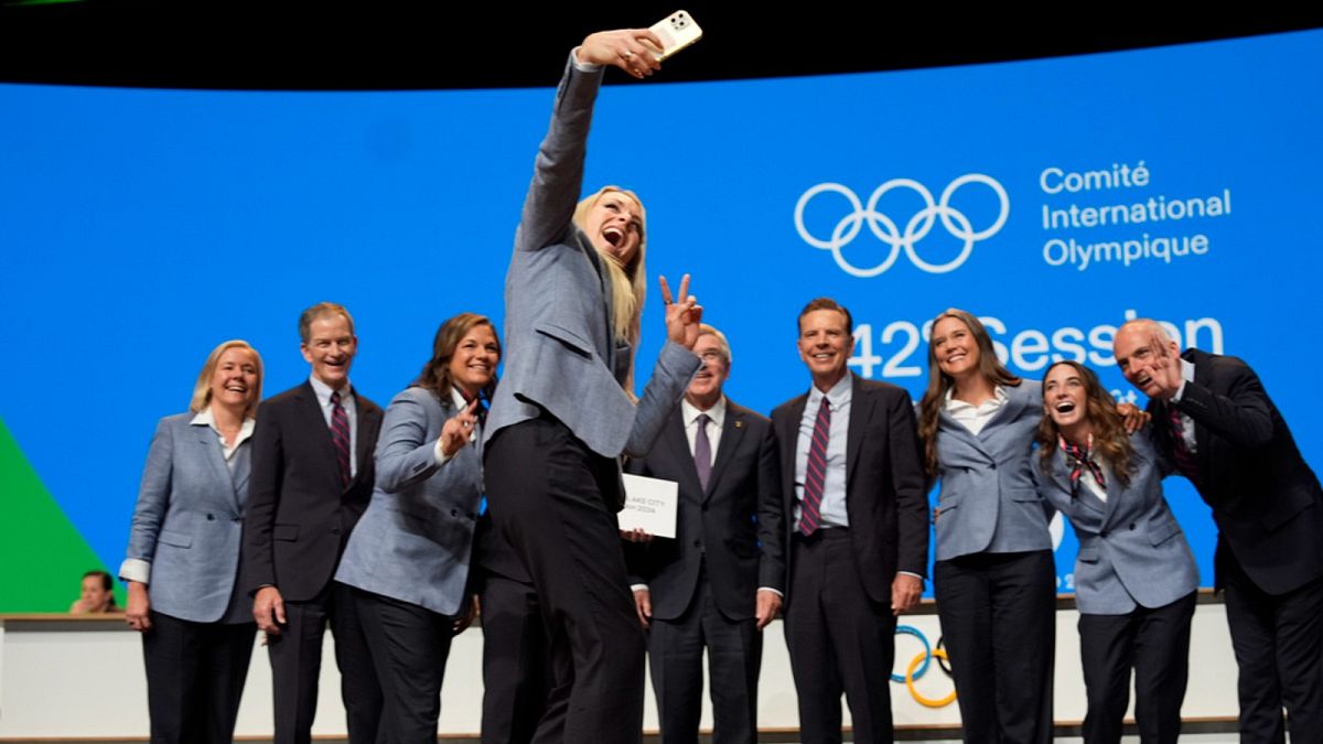 Former US skier Lindsey Vonn makes a selfie with the Salt Lake City delegation after Salt Lake City was named Olympics host again for 2034