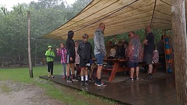Tourists stand in the rain in HighPark Sønderjylland, Denmark.