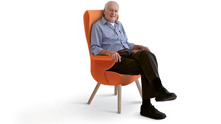 Sir Kenneth Grange sat in the hm82 Edith chair he developed with industrial firm Hitch Mylius specifically for elderly healthcare use