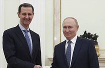 Syrian President Bashar Assad and Russian President Vladimir Putin shake hands during their meeting in Moscow, Russia, Wednesday, July 24, 2024. 