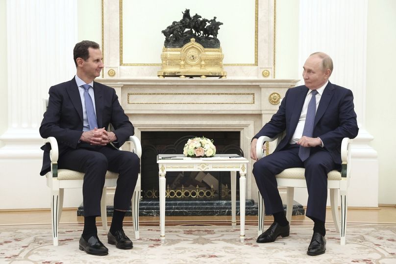 Syrian President Bashar Assad, left, speaks with Russian President Vladimir Putin during their meeting in Moscow, Russia, Wednesday, July 24, 2024.