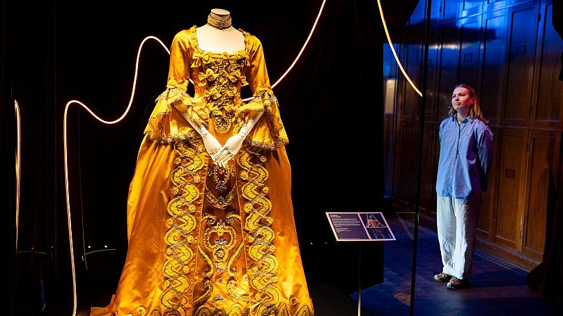 A costume and necklace worn by Taylor Swift in the Bejeweled music video displayed at the 'Taylor Swift Songbook Trail Exhibition'